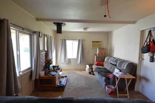 a living room with furniture and a window