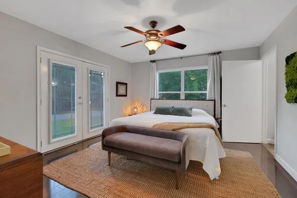 a bed room with a bed and a window