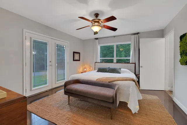 a bed room with a bed and a window