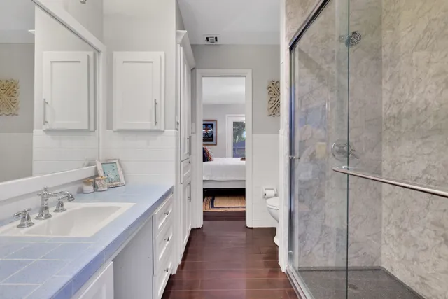 a bathroom with a double vanity sink and a mirror
