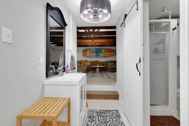 a view of hall way with furniture and window