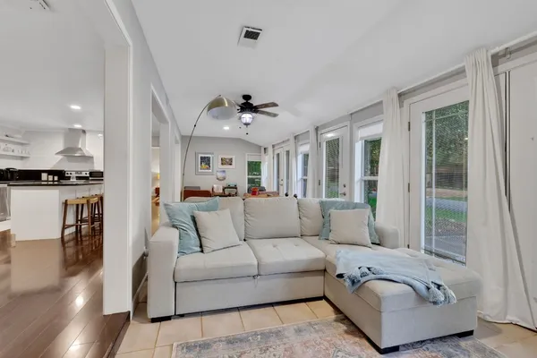 a living room with furniture and a large window