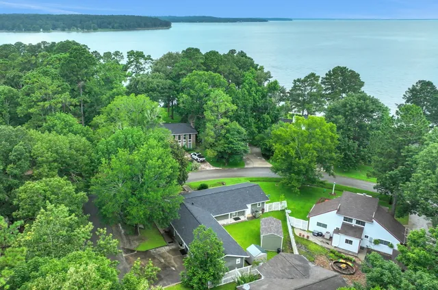 an aerial view of a house with pool and outdoor space