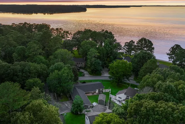 an aerial view of a house with a yard