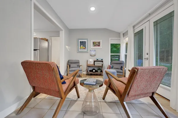 a living room with furniture and a window