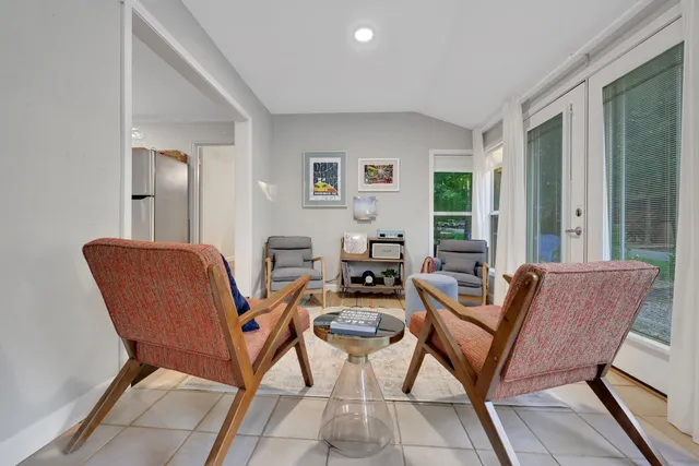 a living room with furniture and a window