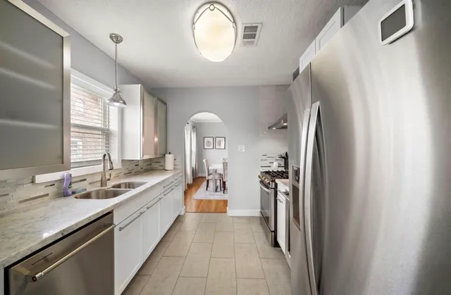 a view of a house with a wooden deck