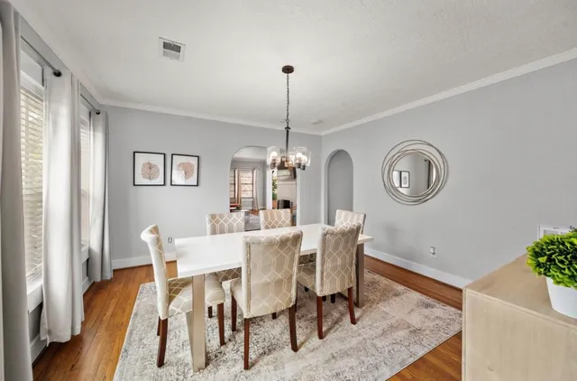 a view of a balcony with wooden floor and fence