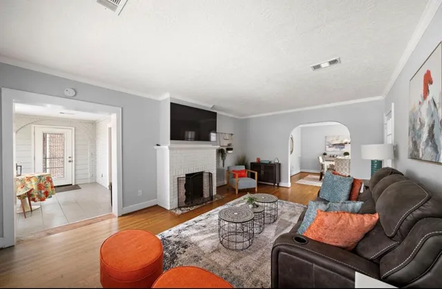 a kitchen with stainless steel appliances granite countertop a sink stove a refrigerator and a microwave