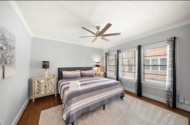 a large kitchen with stainless steel appliances granite countertop a stove a sink and a microwave