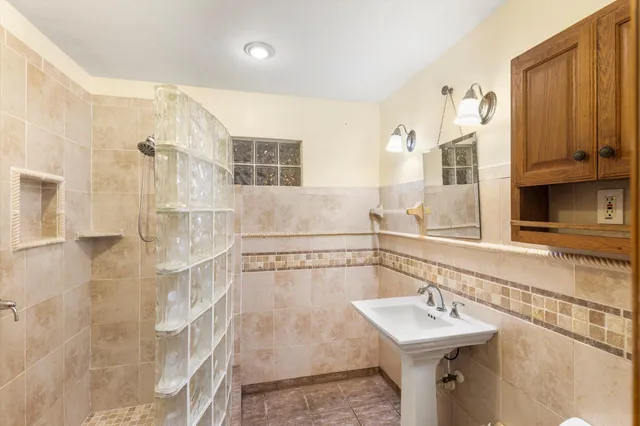 a bathroom with a sink and a mirror