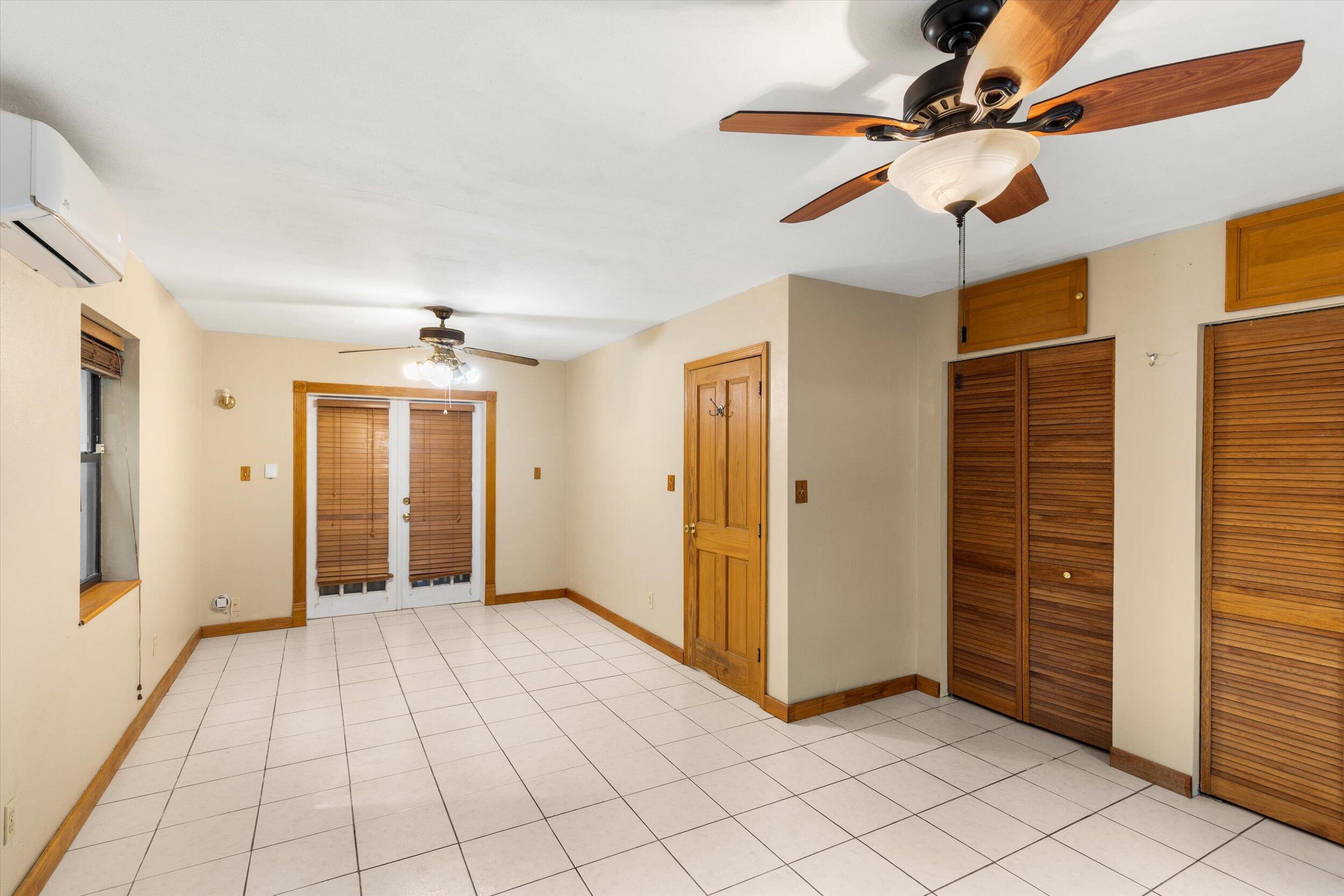 2914 Fogarty Avenue Key West, FL 33040 - Photo 16 of 44 an empty room with windows and fan
