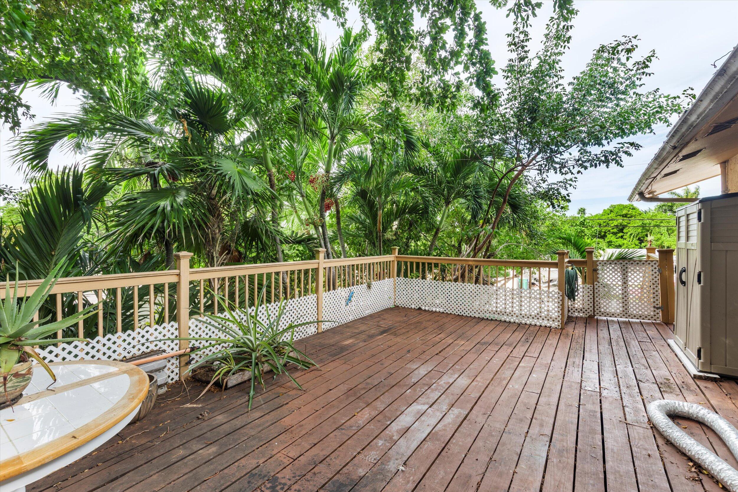 2914 Fogarty Avenue Key West, FL 33040 - Photo 21 of 44 a view of a balcony with wooden floor