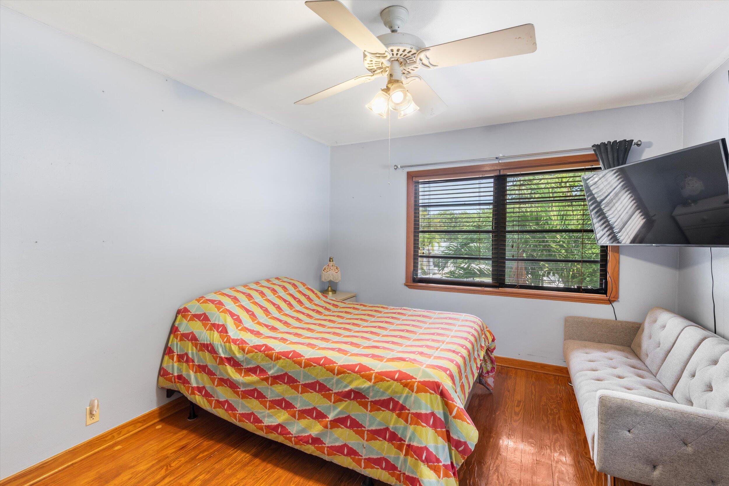 2914 Fogarty Avenue Key West, FL 33040 - Photo 29 of 44 a bedroom with a bed and a window