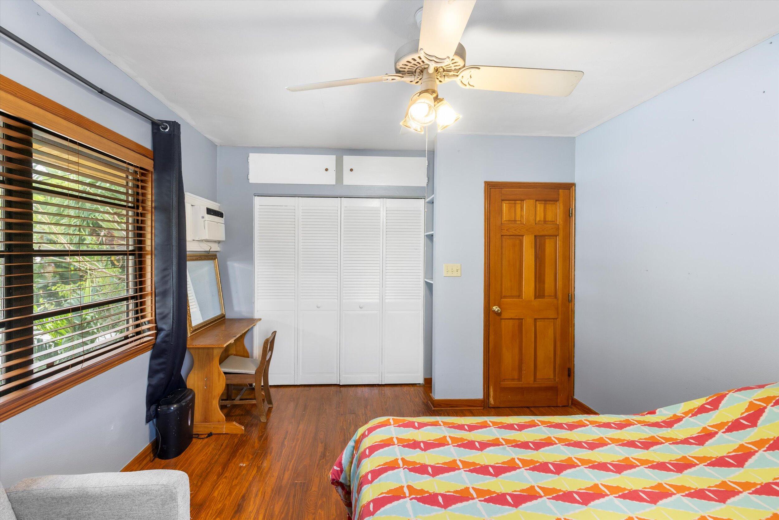 2914 Fogarty Avenue Key West, FL 33040 - Photo 30 of 44 a bedroom with a bed and a chandelier