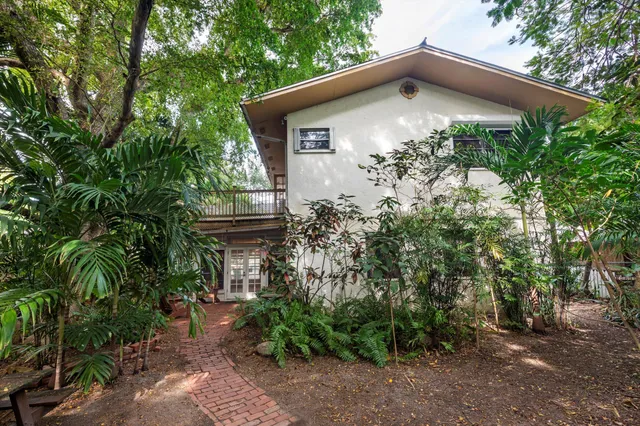 a front view of a house with garden