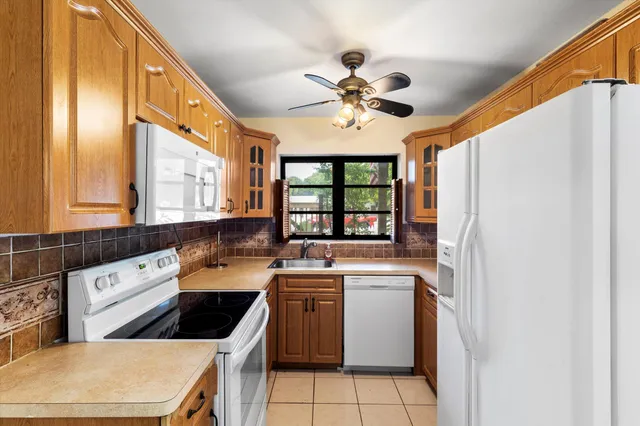 a kitchen that has a cabinets and a stove