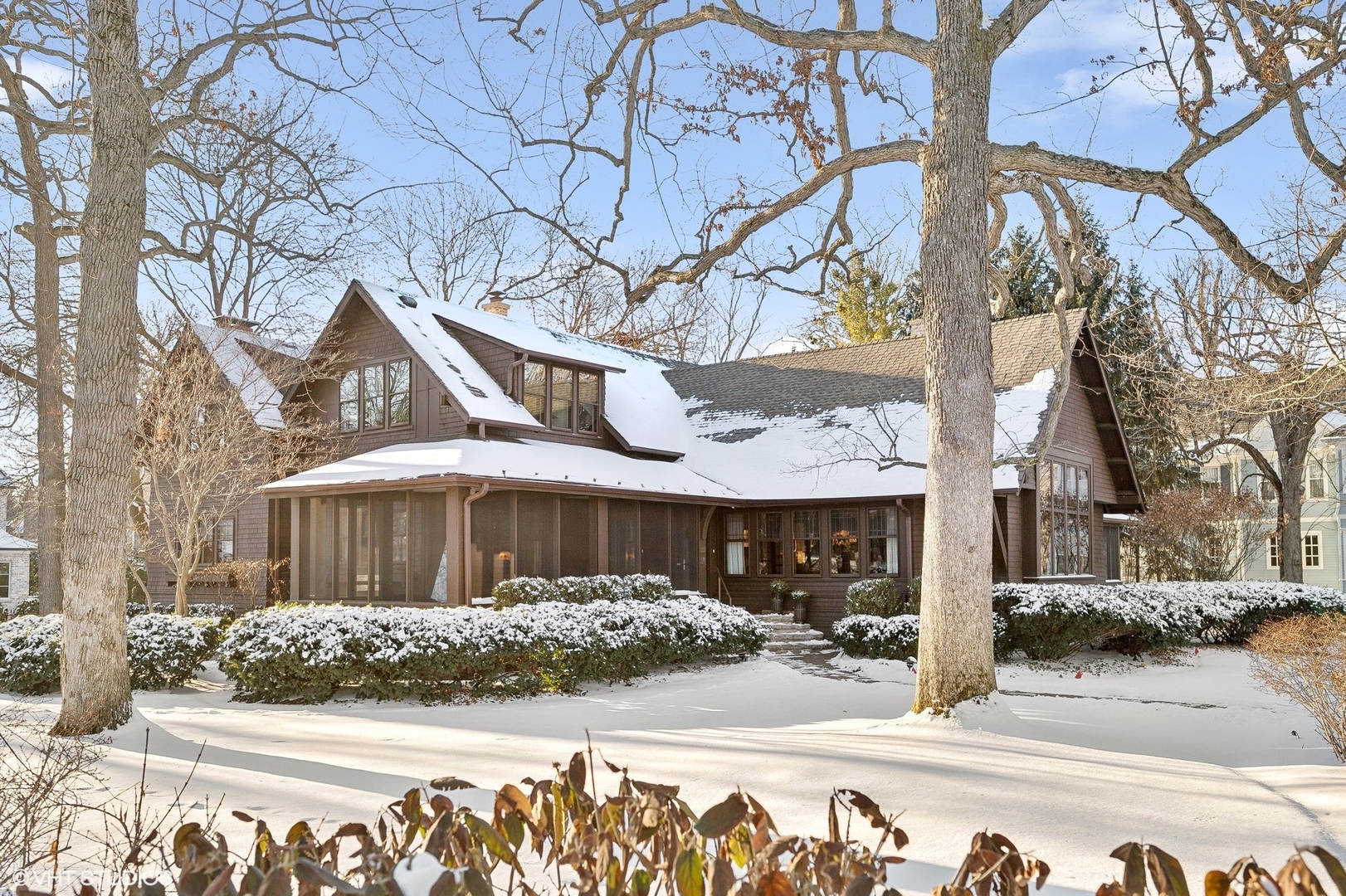 822 Bryant Avenue Winnetka, IL 60093 - Photo 3 of 37 a front view of a house with a yard and tree s