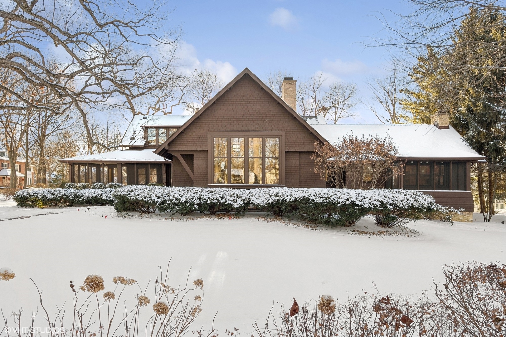 822 Bryant Avenue Winnetka, IL 60093 - Photo 32 of 37 a front view of a house with a yard covered with snow in front of house
