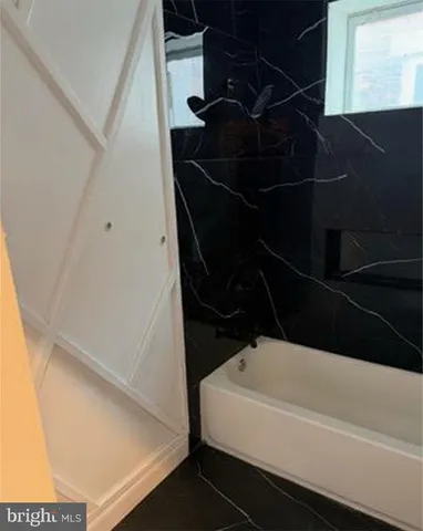 a bathroom with a bathtub