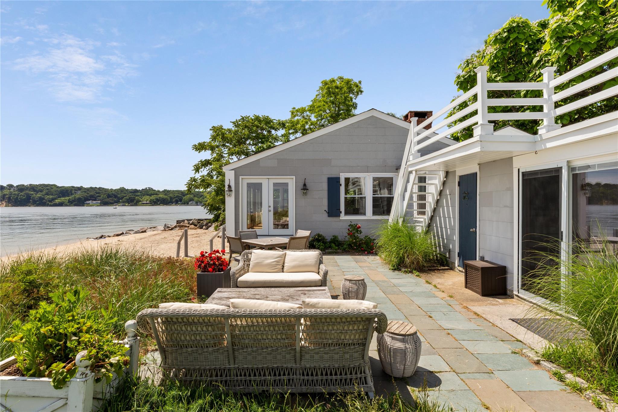 335 Centre Island Road Oyster Bay, NY 11771 - Photo 1 of 1 a view of a patio with couches chairs and potted plants
