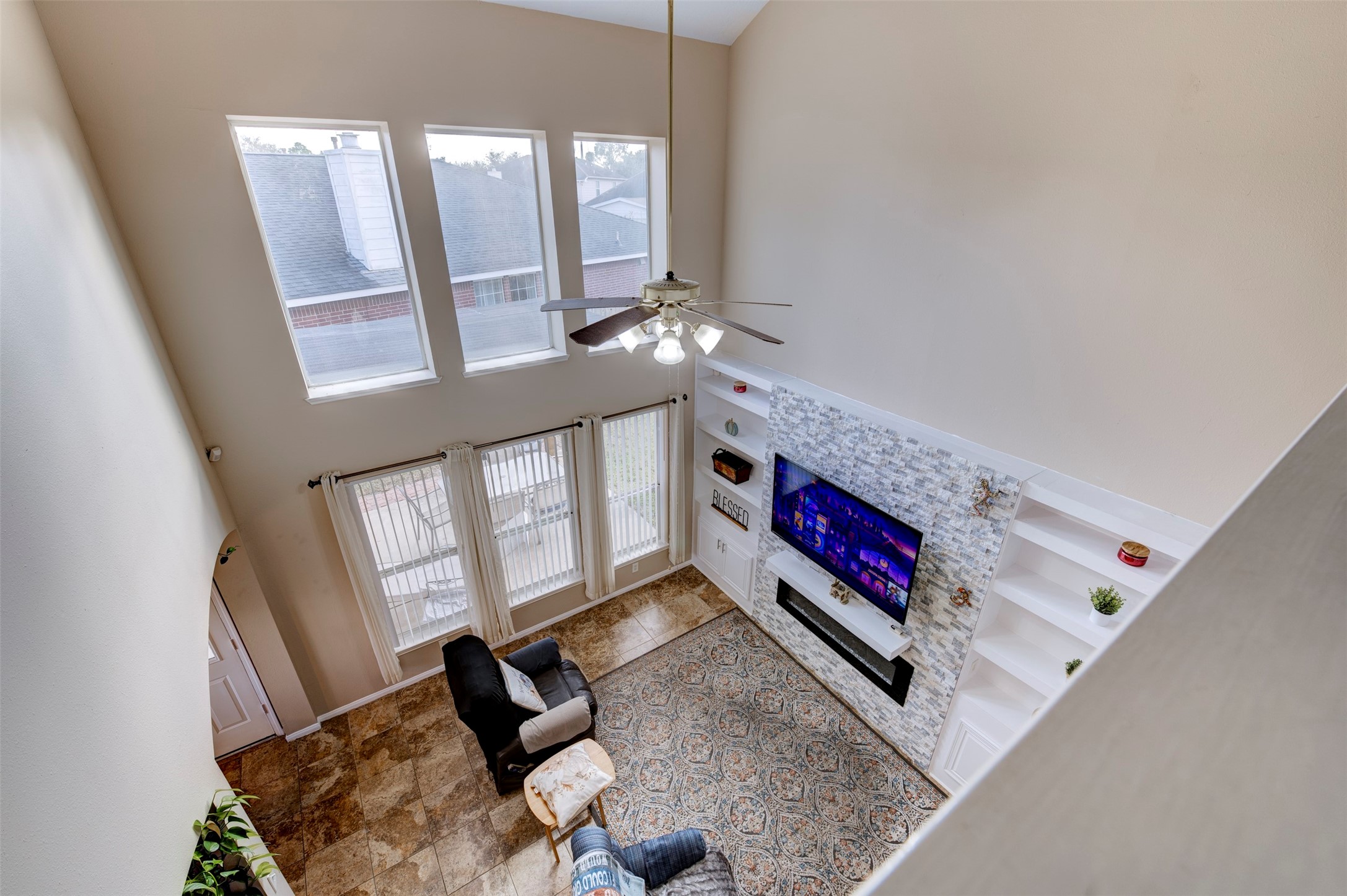 9214 Windy Spring Court Houston, TX 77089 - Photo 11 of 50 a living room with furniture and a flat screen tv