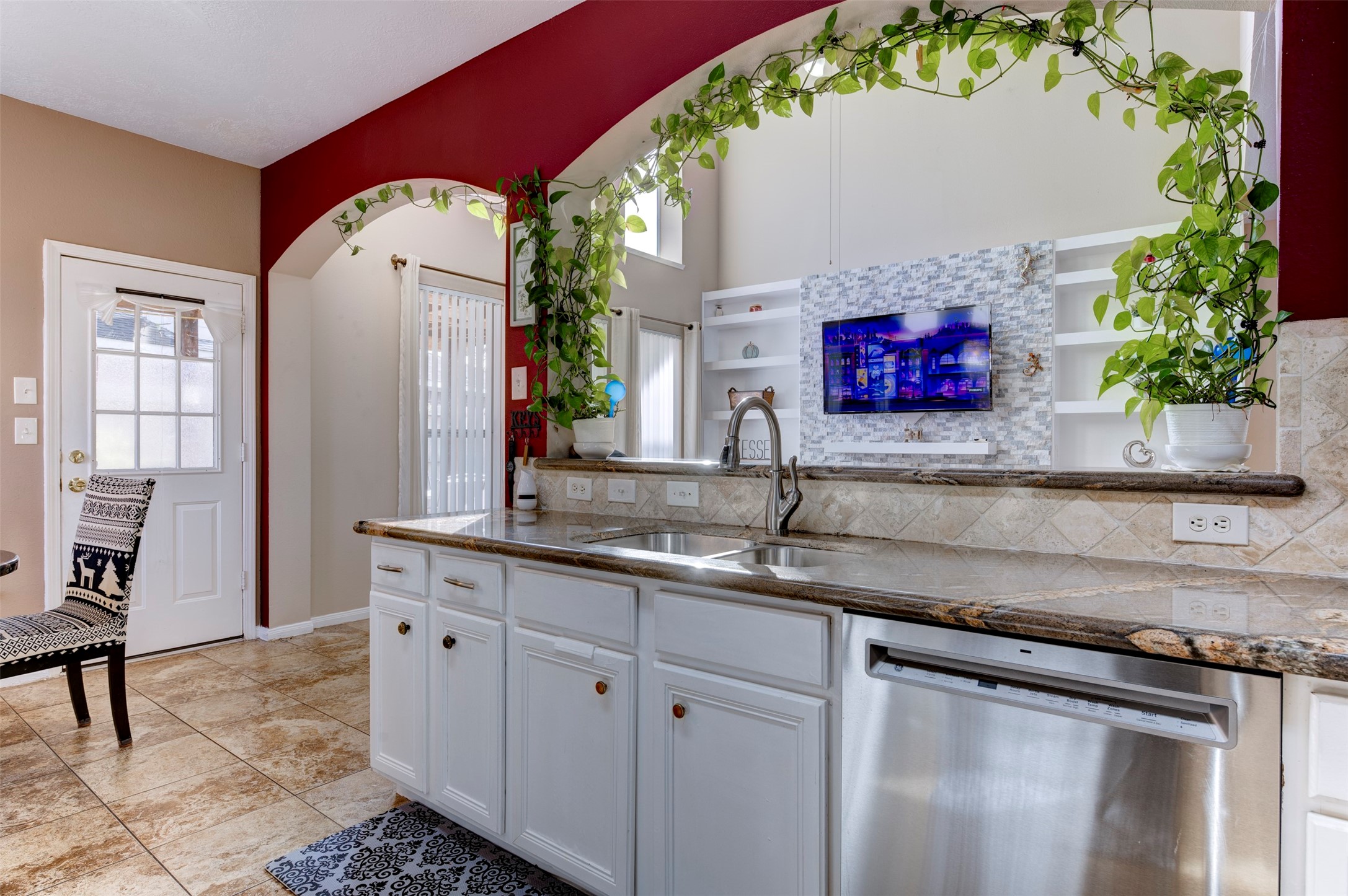 9214 Windy Spring Court Houston, TX 77089 - Photo 17 of 50 a kitchen with stainless steel appliances granite countertop a sink stove and cabinets