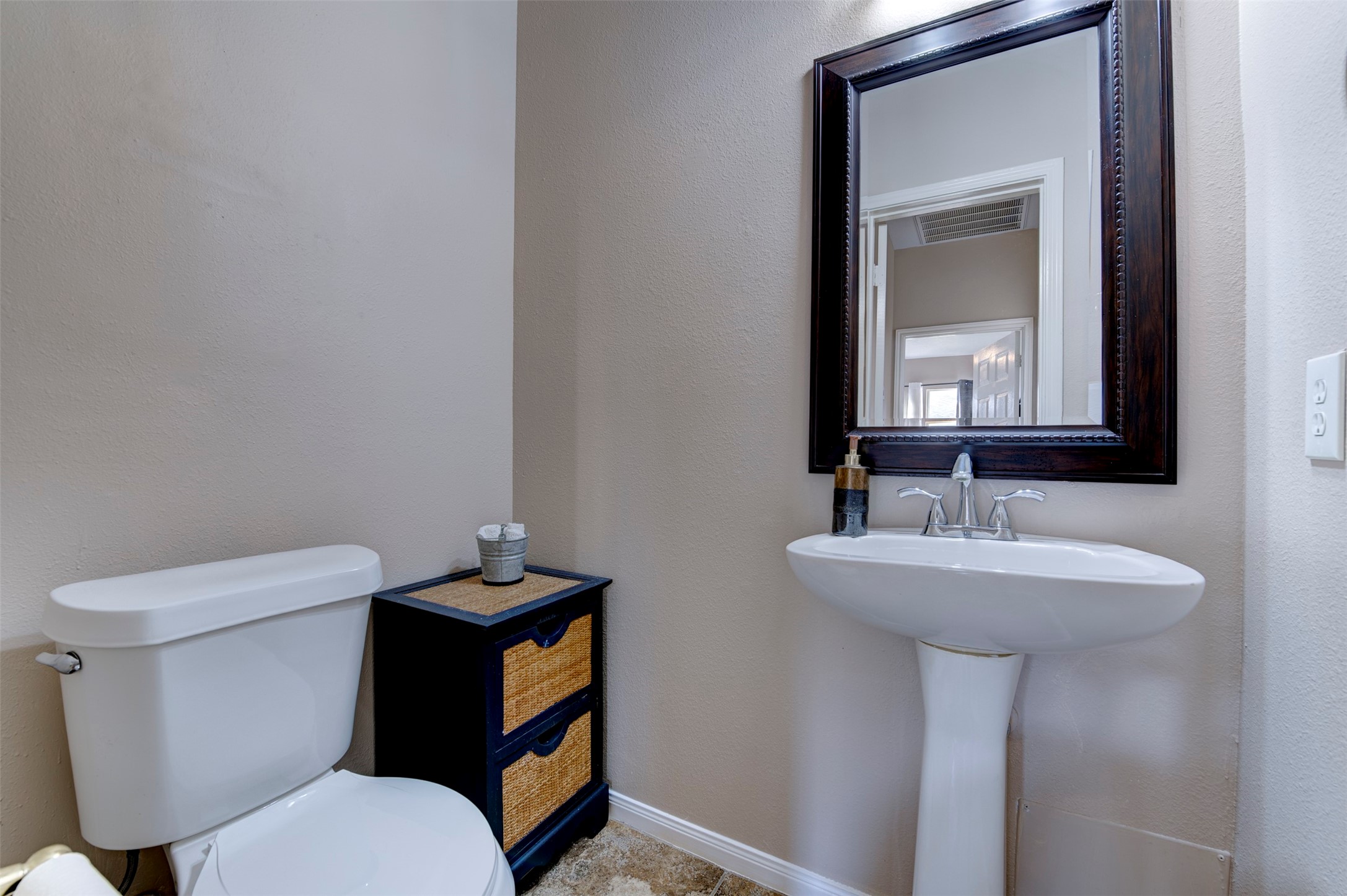 9214 Windy Spring Court Houston, TX 77089 - Photo 20 of 50 a bathroom with a toilet sink and mirror