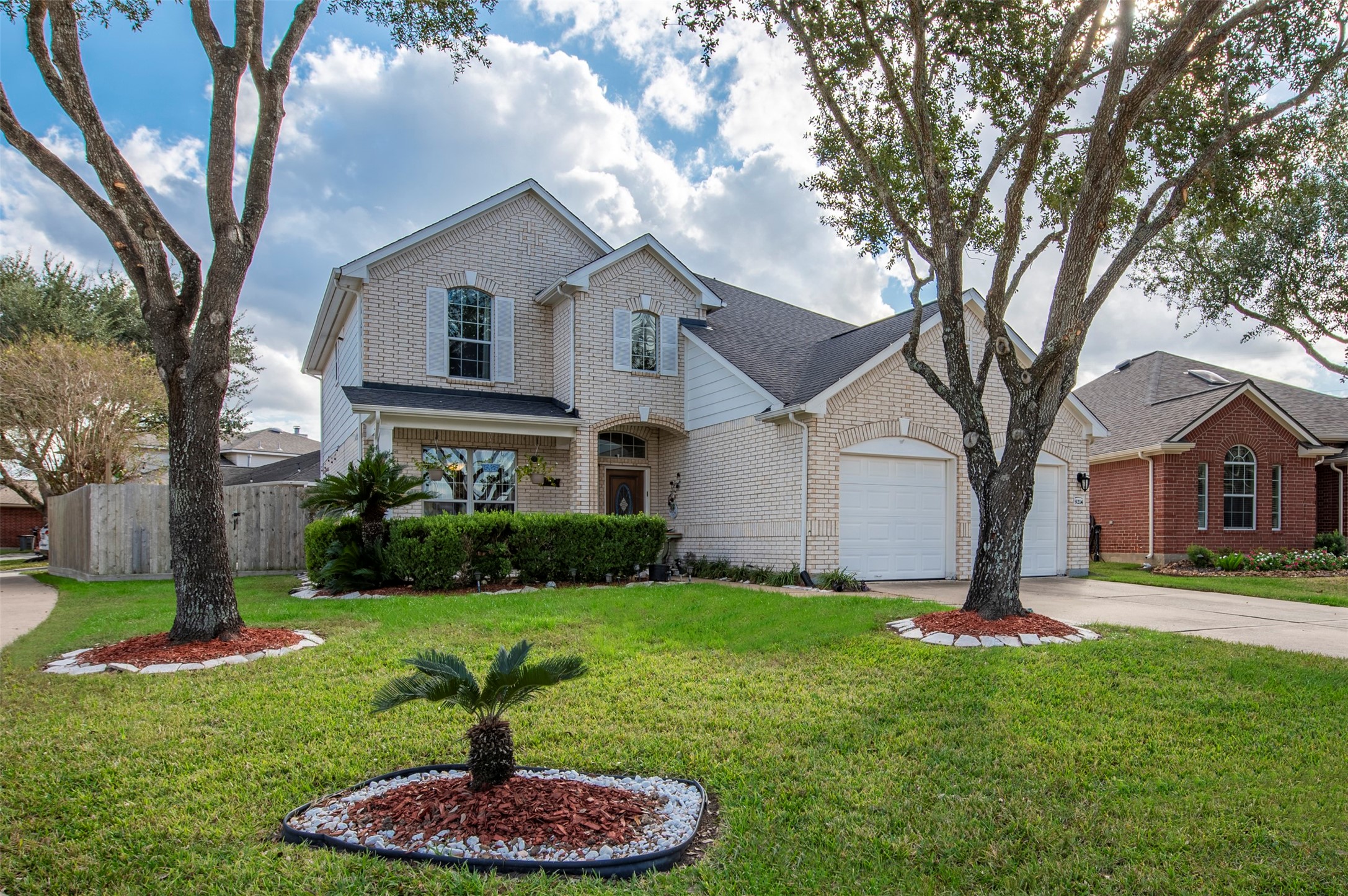 9214 Windy Spring Court Houston, TX 77089 - Photo 2 of 50 a front view of a house with a yard and garage