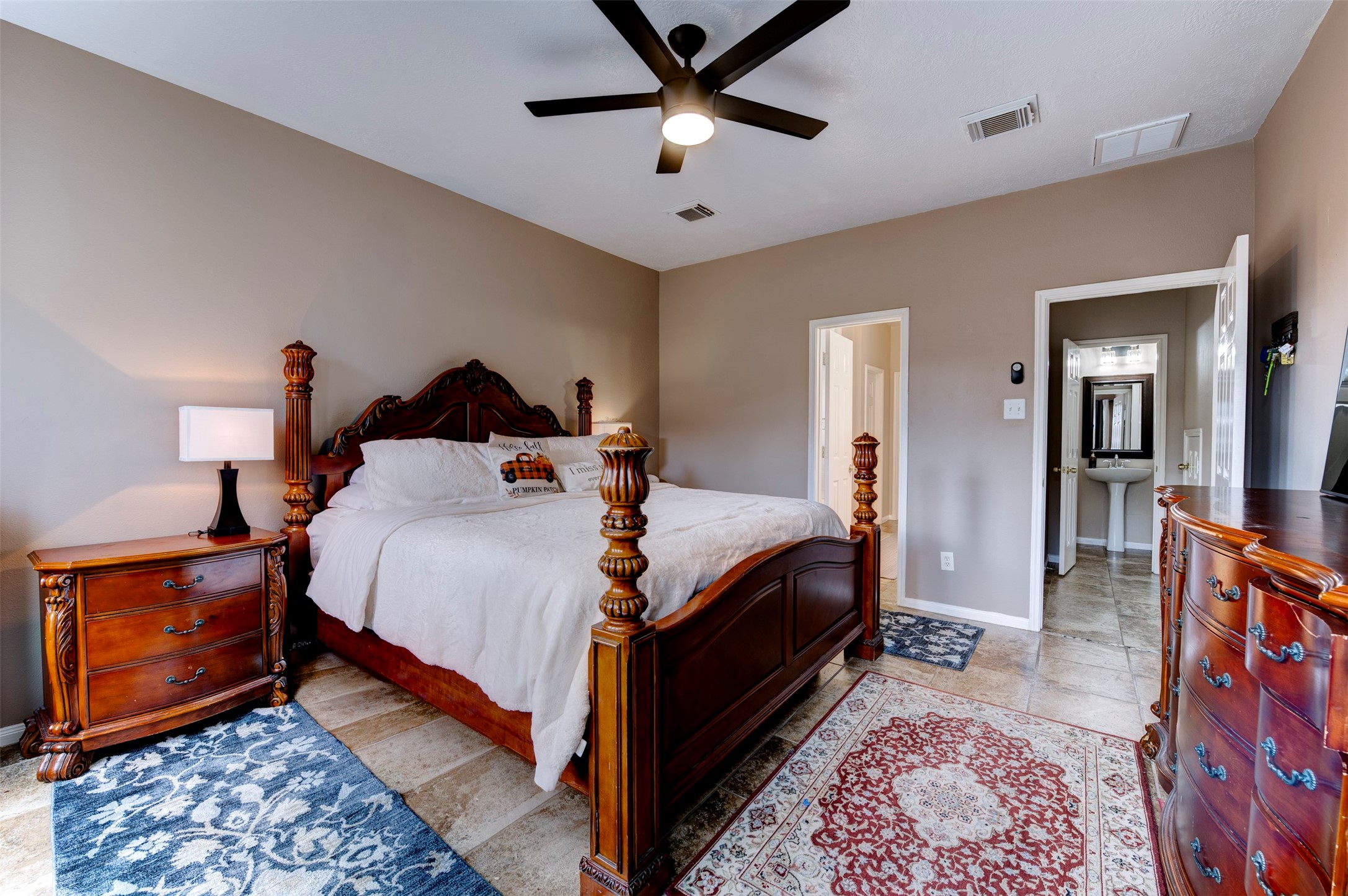 9214 Windy Spring Court Houston, TX 77089 - Photo 22 of 50 a bed room with a bed and a lamp