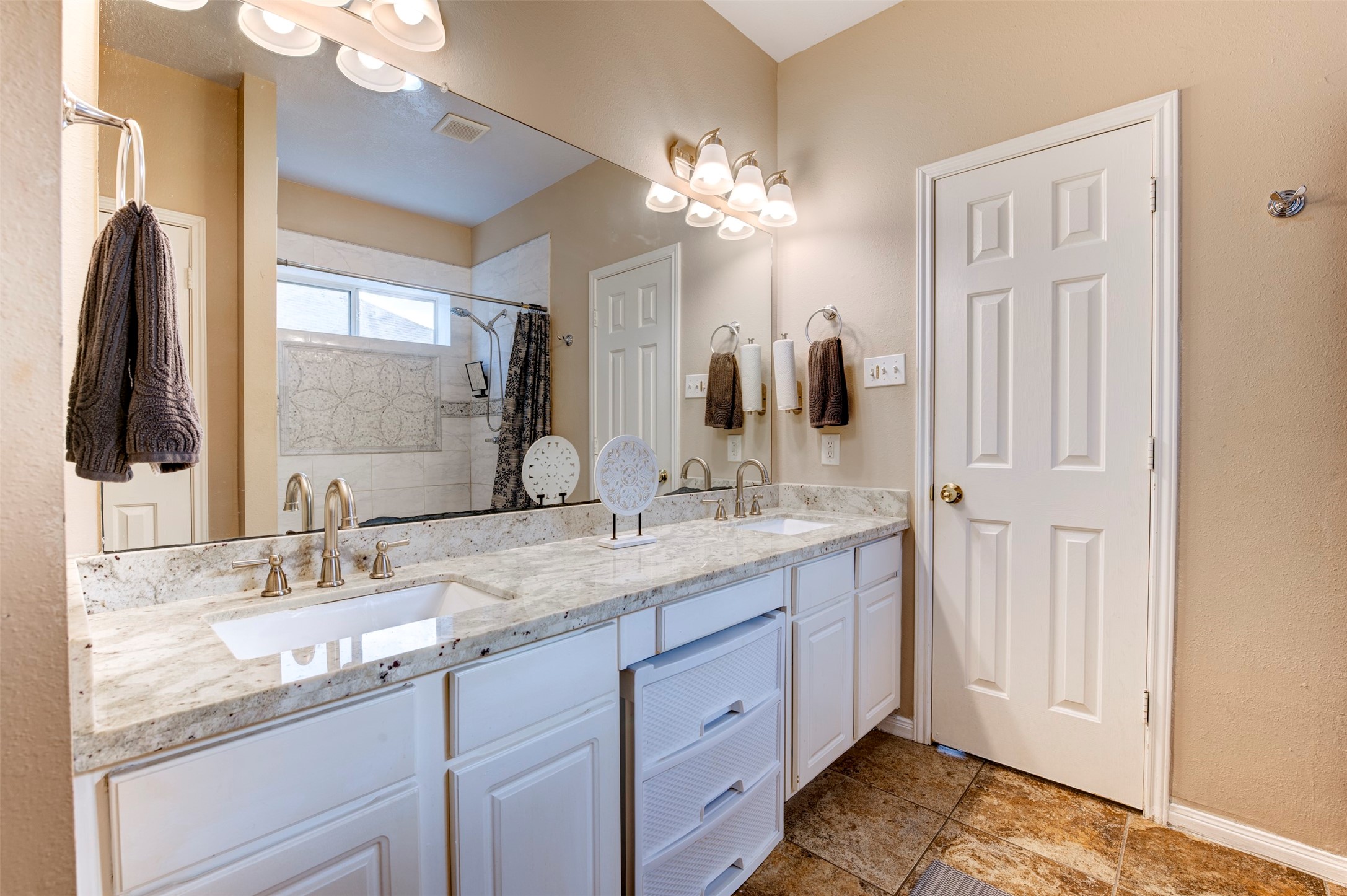 9214 Windy Spring Court Houston, TX 77089 - Photo 25 of 50 a bathroom with a granite countertop sink and a mirror