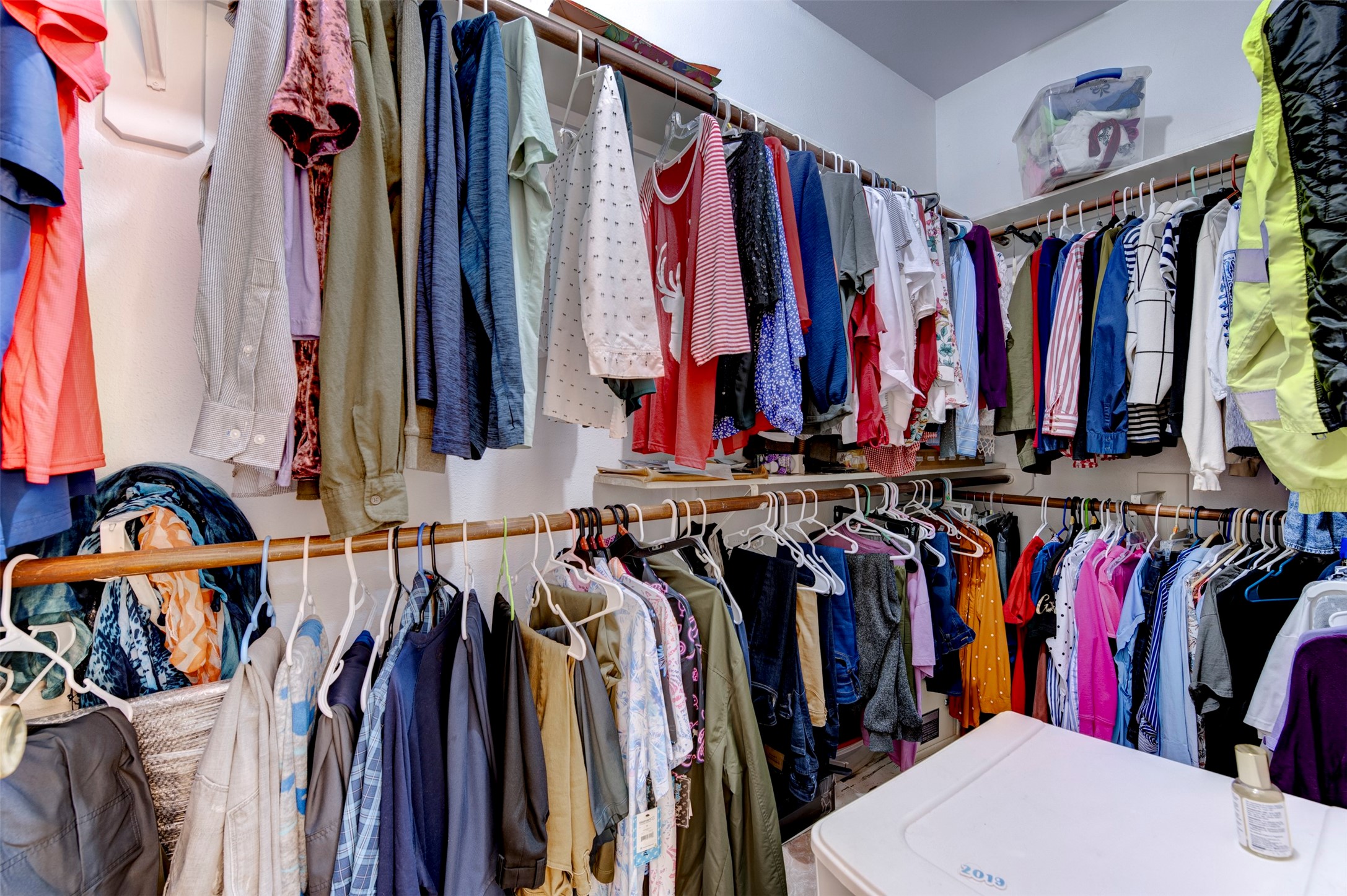 9214 Windy Spring Court Houston, TX 77089 - Photo 26 of 50 a view of walk in closet with clothes