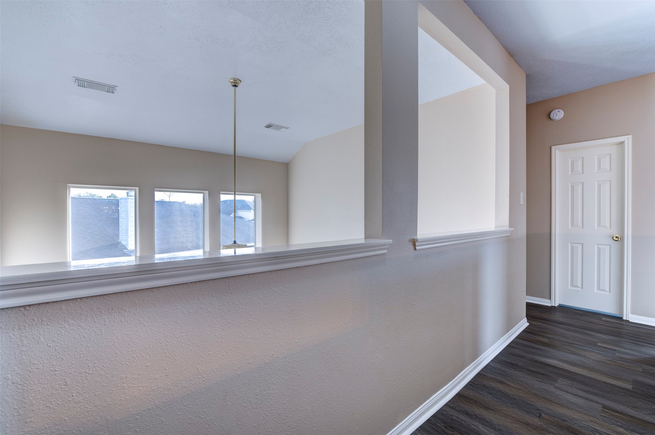9214 Windy Spring Court Houston, TX 77089 - Photo 33 of 50 a view of a kitchen with wooden floor and staircase