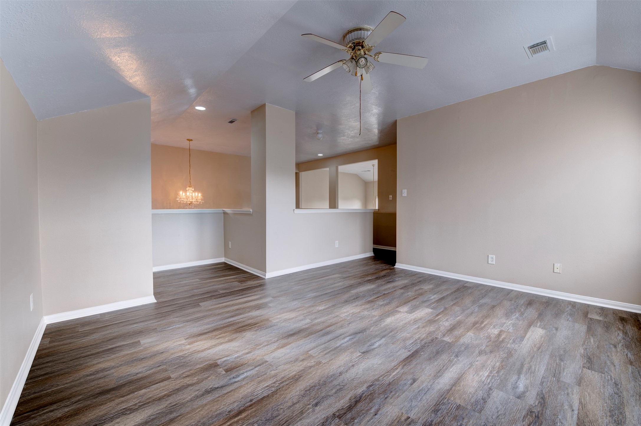 9214 Windy Spring Court Houston, TX 77089 - Photo 38 of 50 a view of empty room with wooden floor and fan