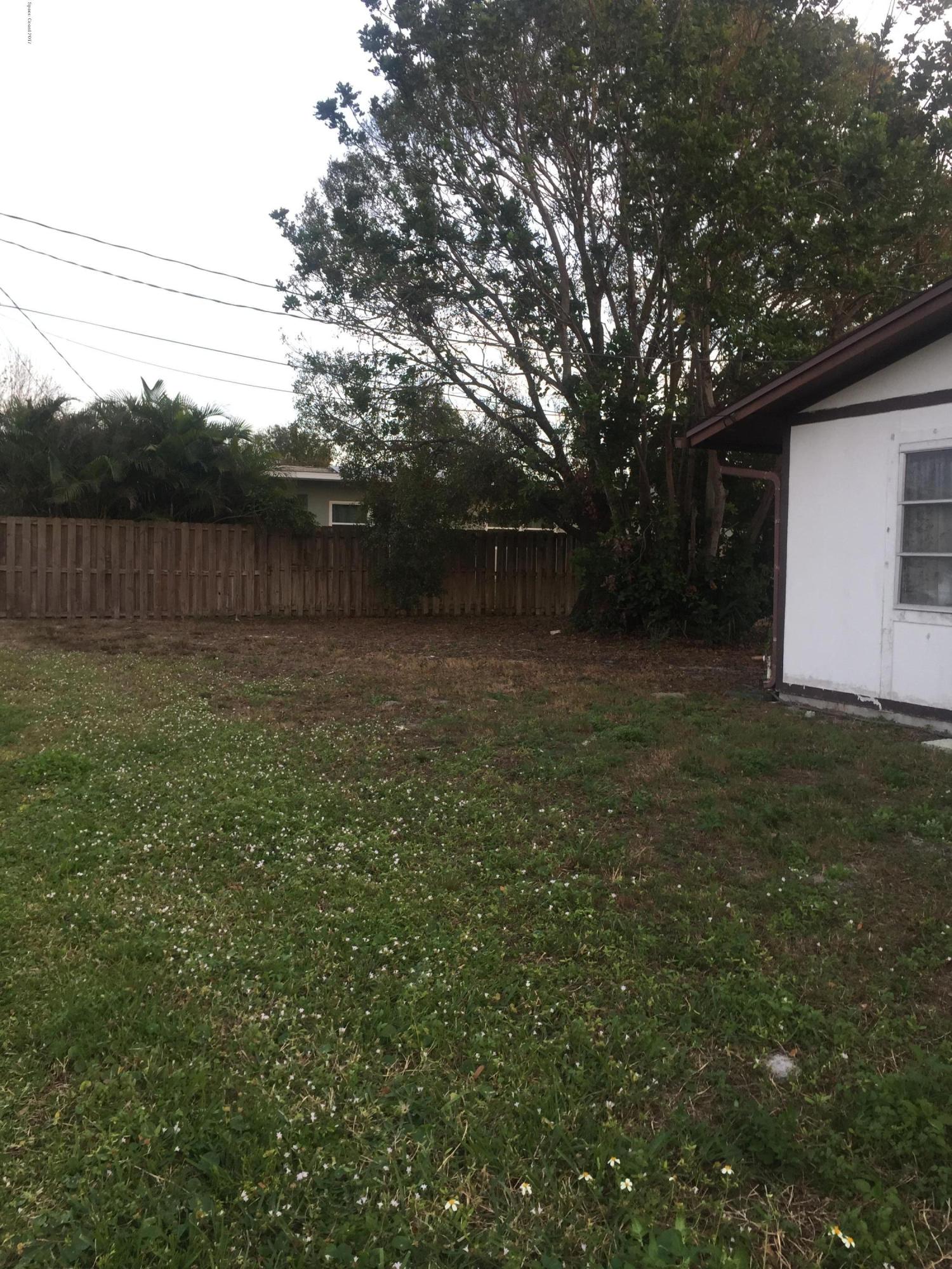 799 Hampton Drive Northeast Palm Bay, FL 32905 - Photo 3 of 9 SIDE YARD