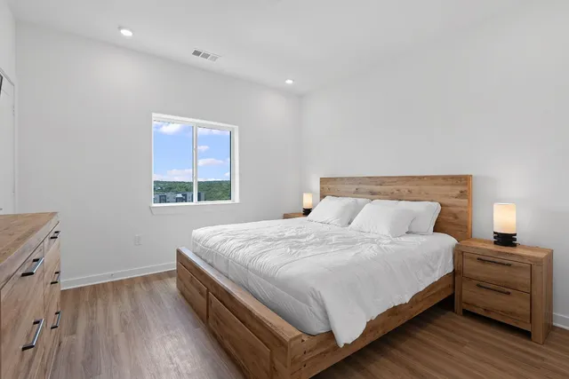 a bedroom with a bed and a cabinets