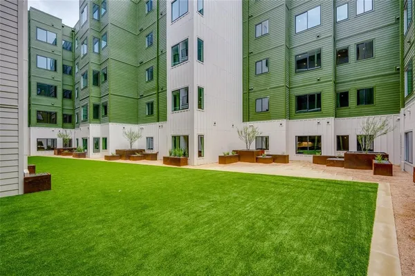 a swimming pool with trees in the background