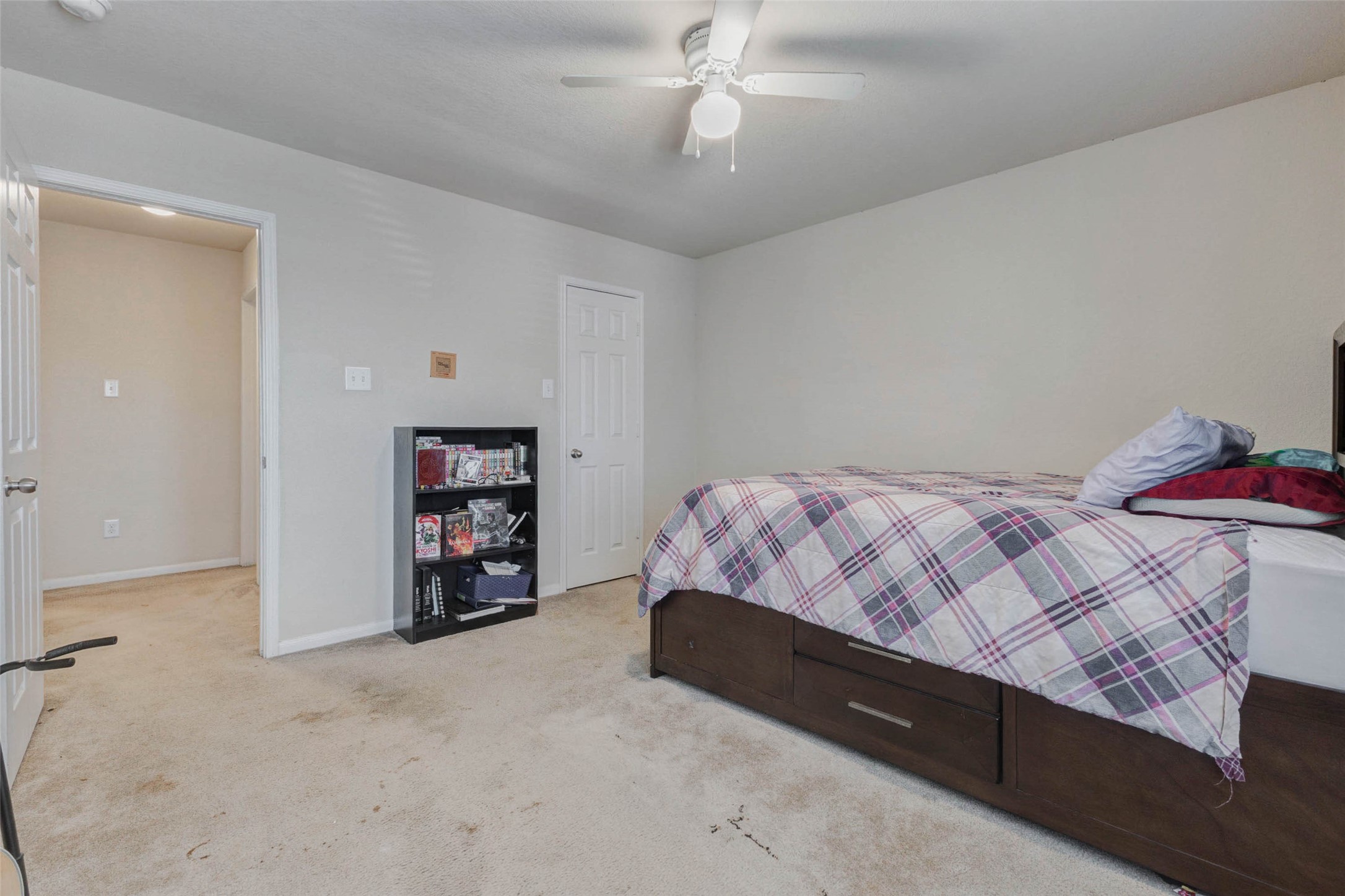 3027 Upland Spring Trace Katy, TX 77493 - Photo 21 of 29 a bedroom with a bed and a walk in closet