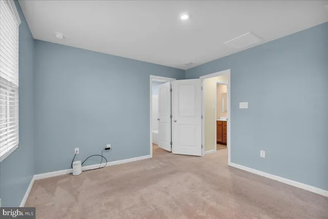 a room with a bed and a window