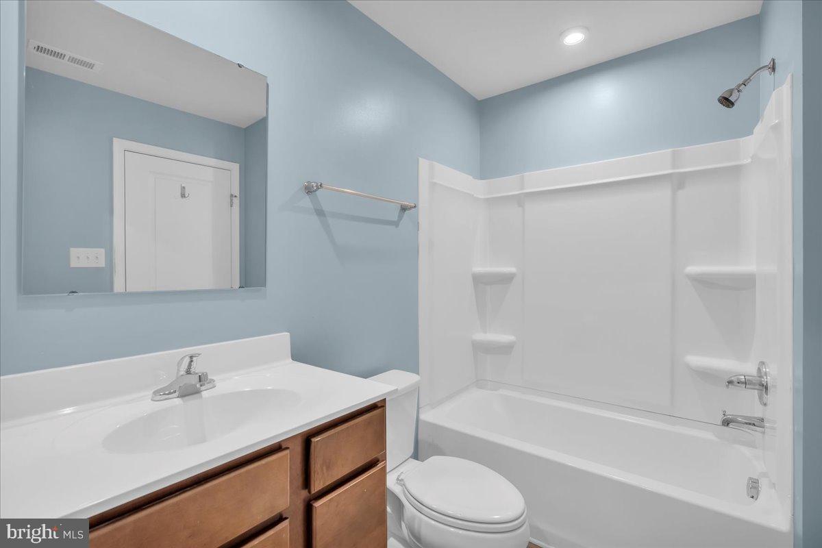 317 Comfort Road Williamstown, NJ 08094 - Photo 17 of 20 a bathroom with a bathtub shower sink vanity and toilet