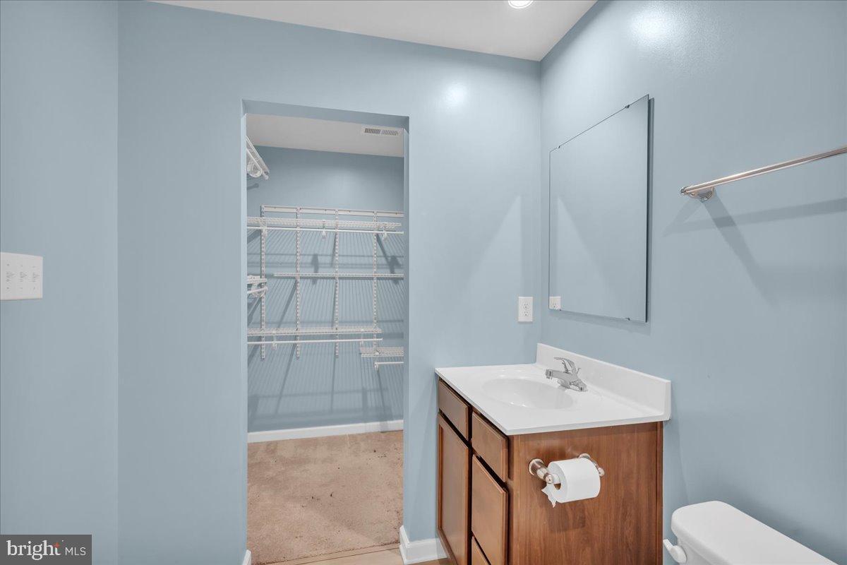 317 Comfort Road Williamstown, NJ 08094 - Photo 18 of 20 a bathroom with a sink toilet and vanity