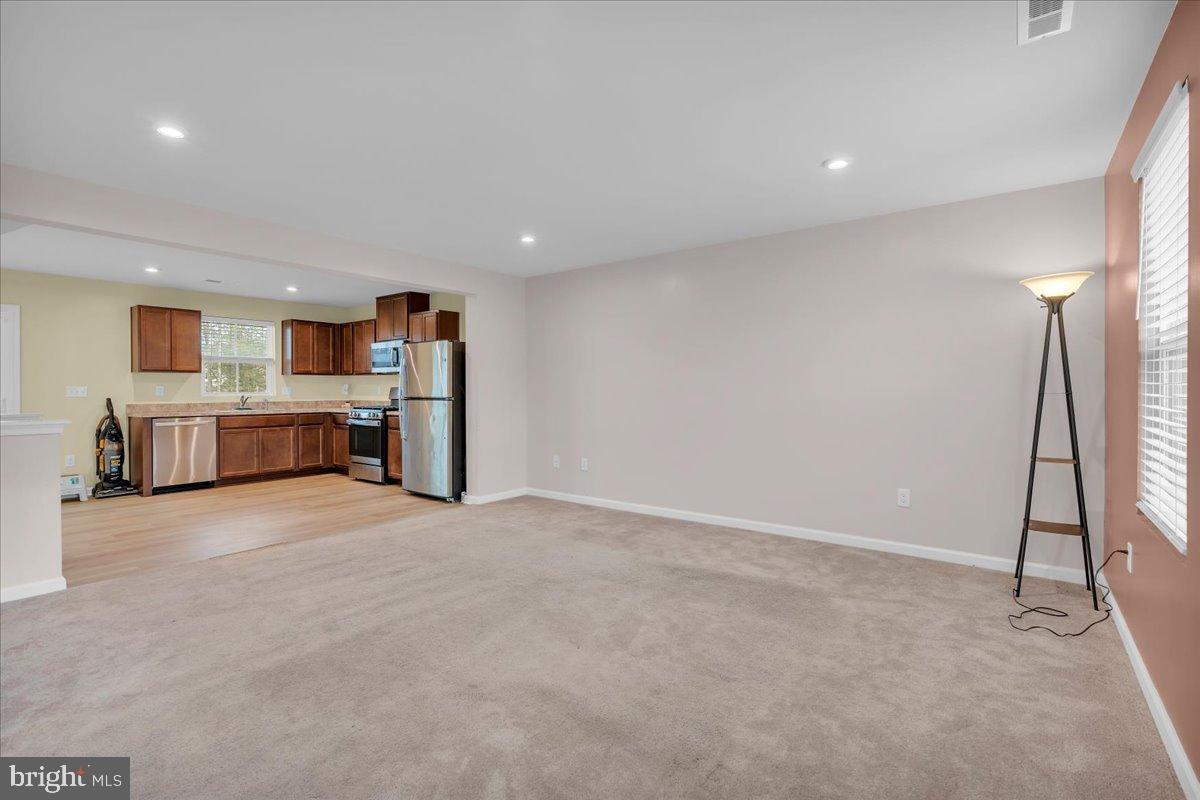 317 Comfort Road Williamstown, NJ 08094 - Photo 7 of 20 an empty room with fireplace and windows