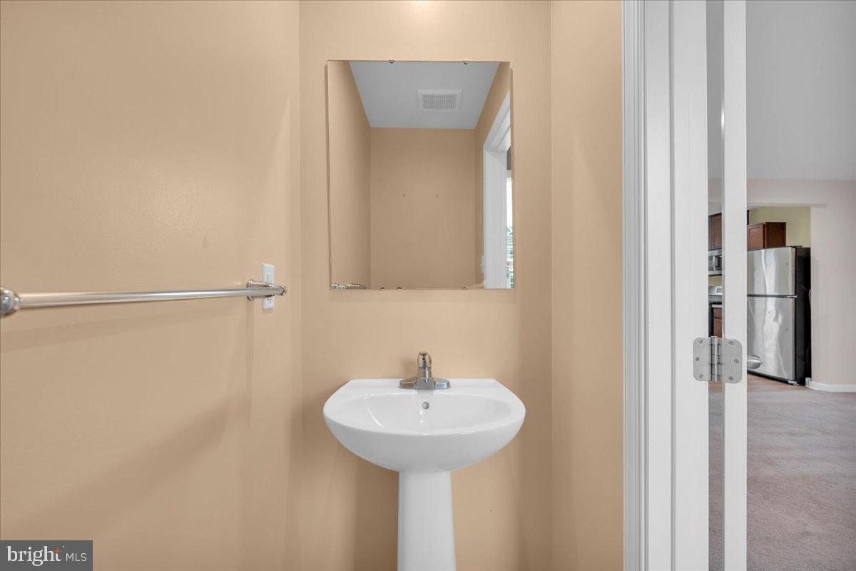 317 Comfort Road Williamstown, NJ 08094 - Photo 9 of 20 a bathroom with a sink and a mirror