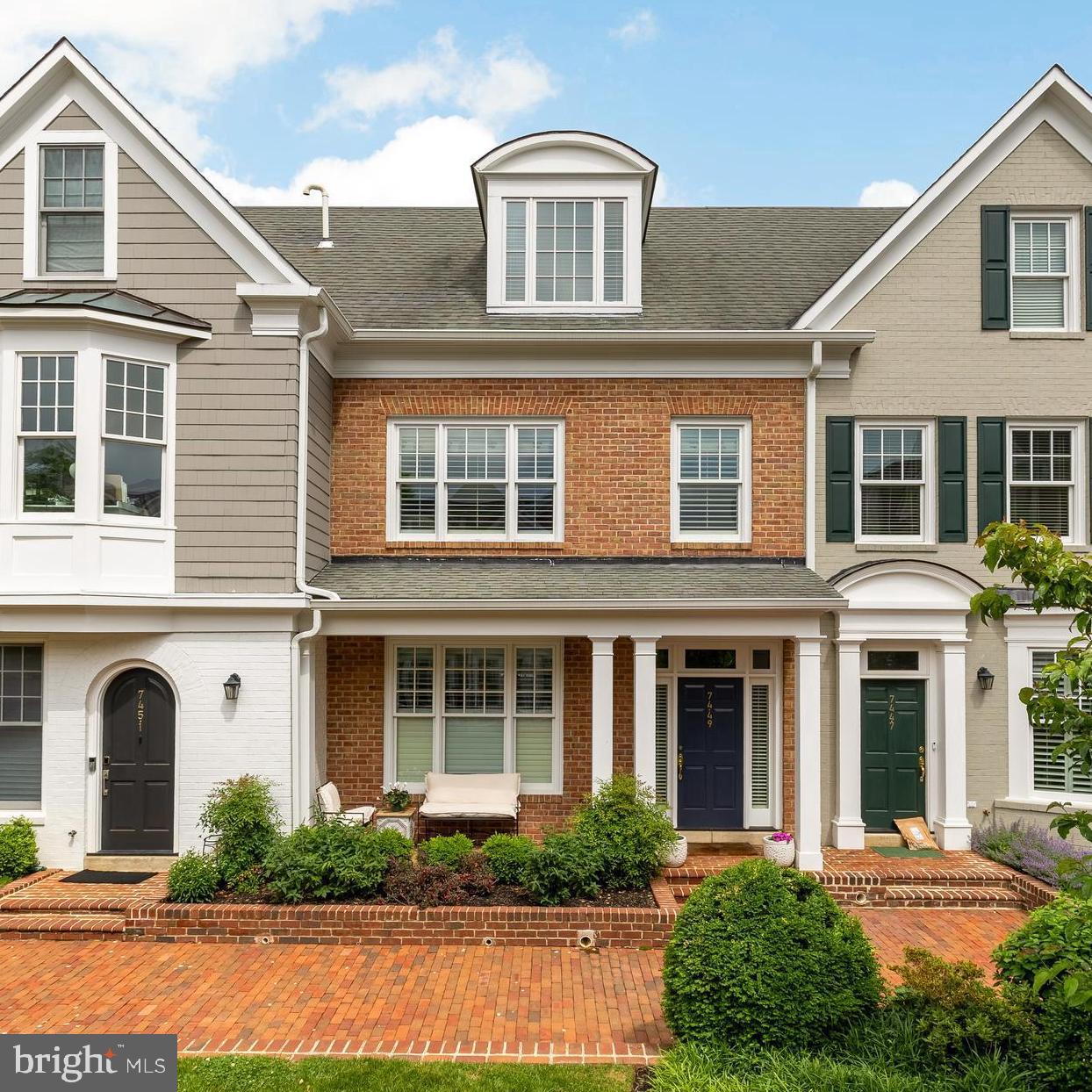 7449 Arlington Road Bethesda, MD 20814 - Photo 1 of 35 a front view of a house with a yard