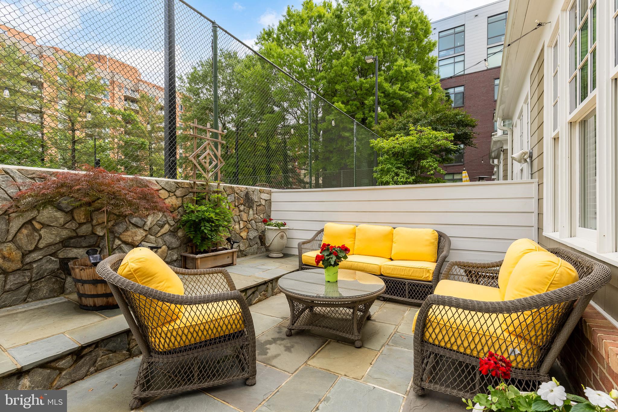 7449 Arlington Road Bethesda, MD 20814 - Photo 16 of 35 a view of a patio with couches chairs and a potted plant