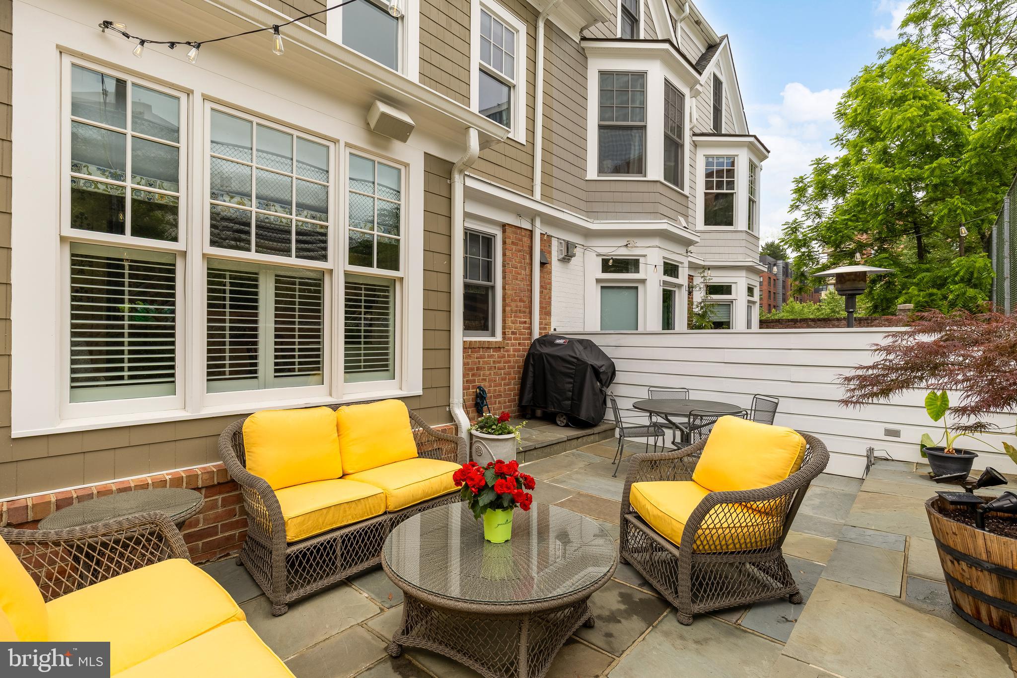 7449 Arlington Road Bethesda, MD 20814 - Photo 17 of 35 a backyard of a house with seating space