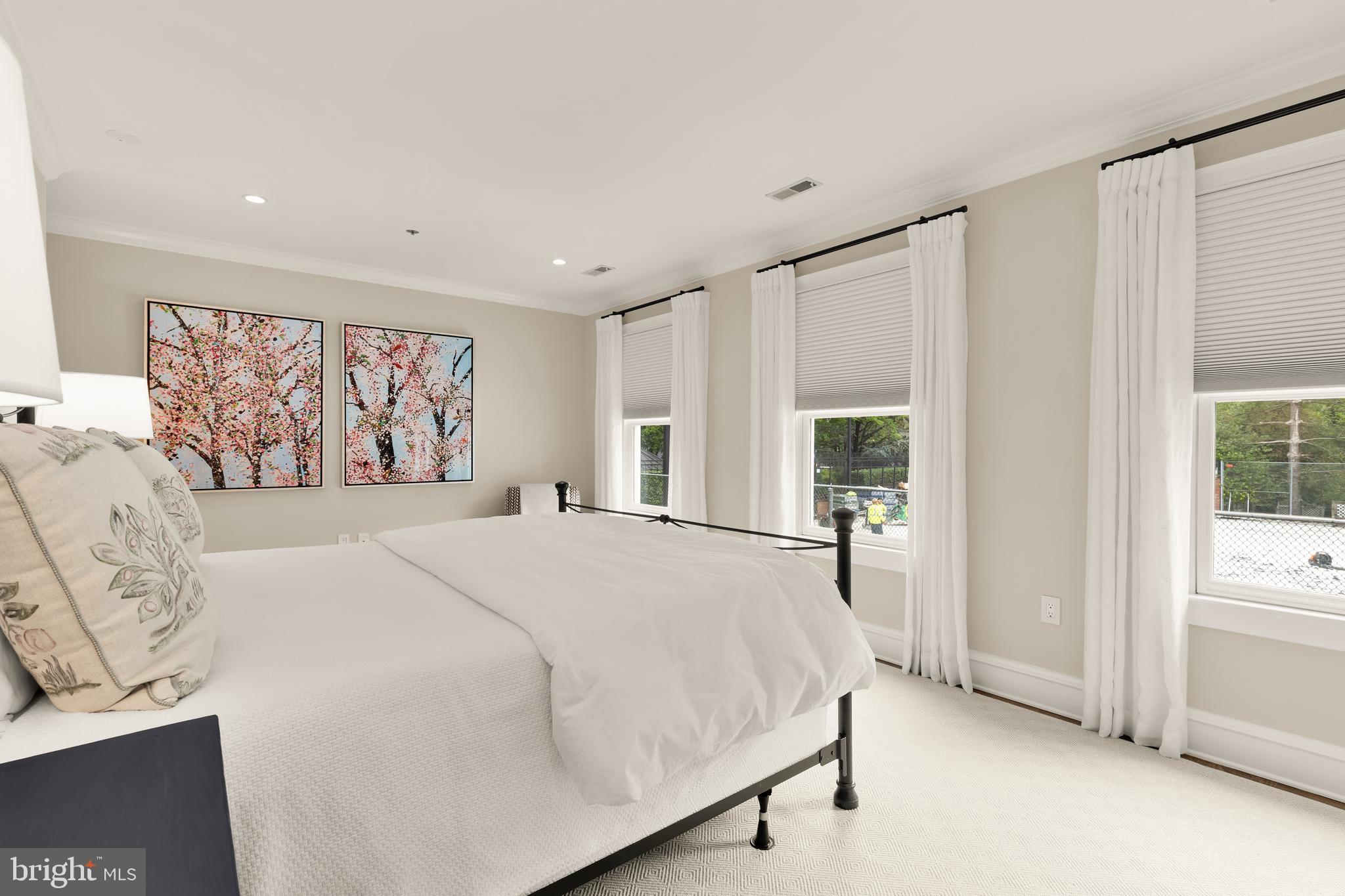 7449 Arlington Road Bethesda, MD 20814 - Photo 19 of 35 a bedroom with a large bed and a window