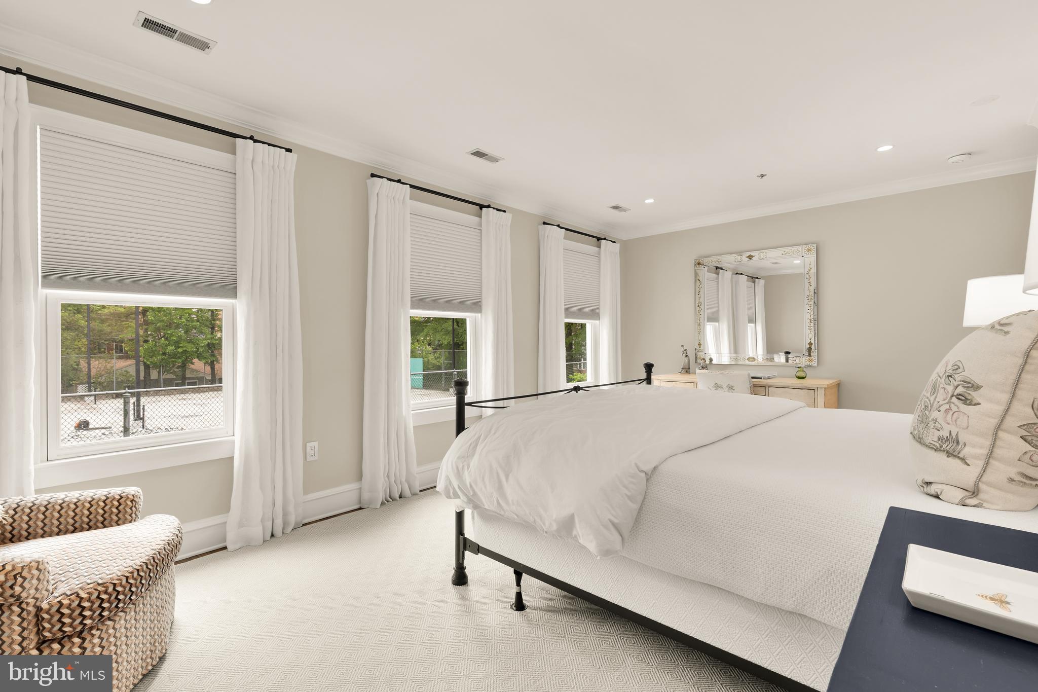 7449 Arlington Road Bethesda, MD 20814 - Photo 20 of 35 a bed room with a bed and a couch