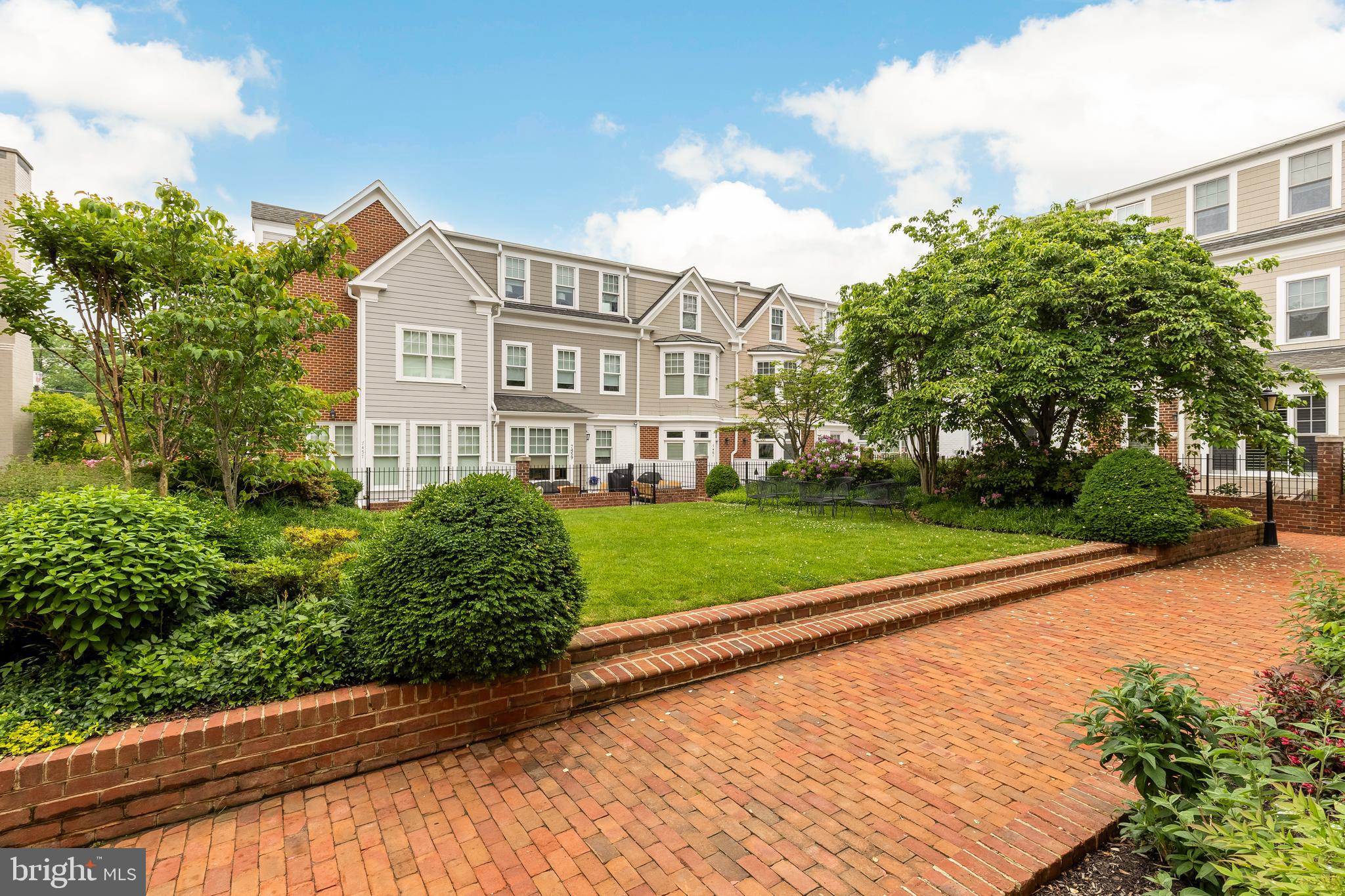 7449 Arlington Road Bethesda, MD 20814 - Photo 2 of 35 a view of a house with a yard and plants