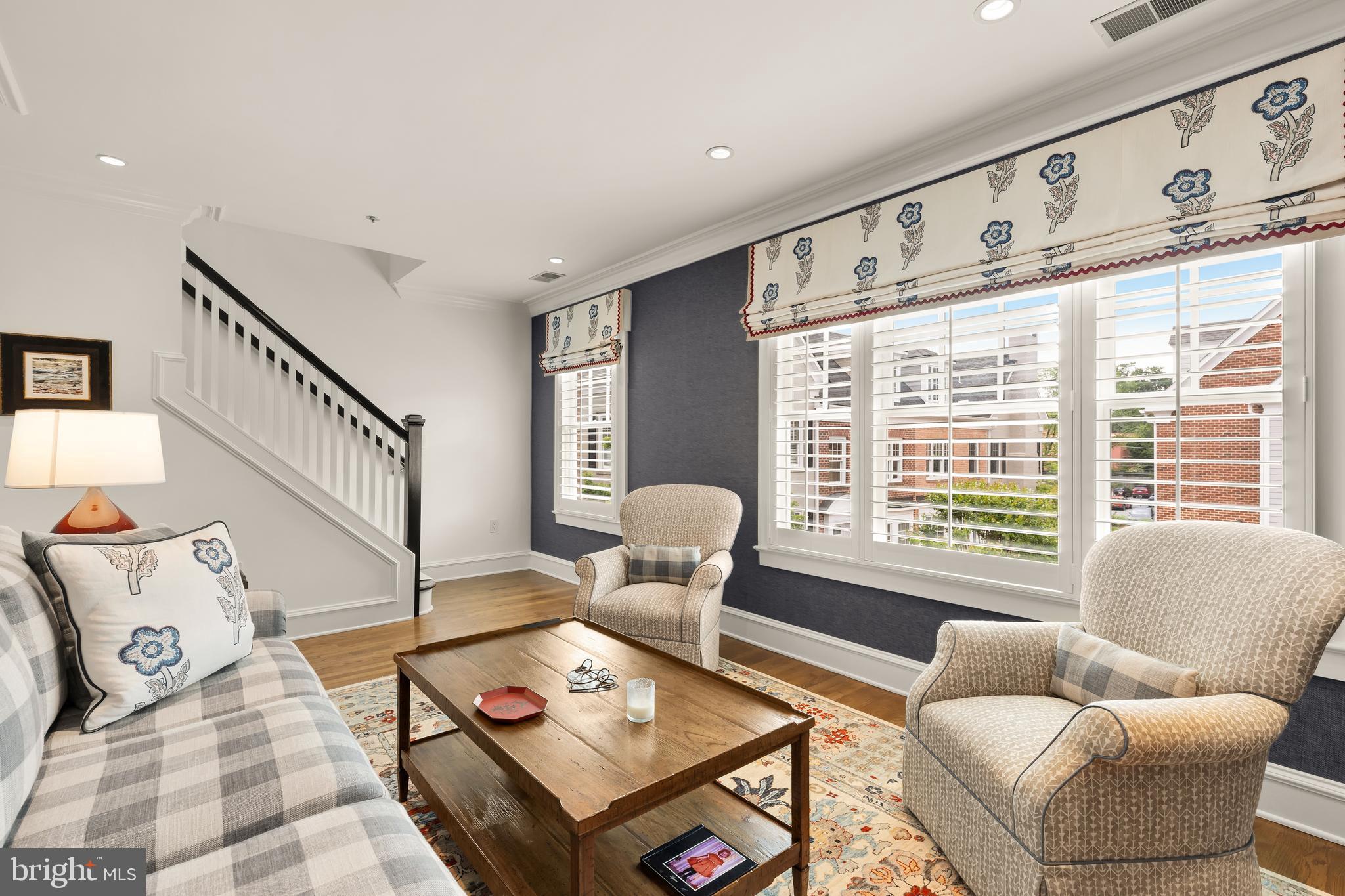 7449 Arlington Road Bethesda, MD 20814 - Photo 26 of 35 a living room with furniture and floor to ceiling windows